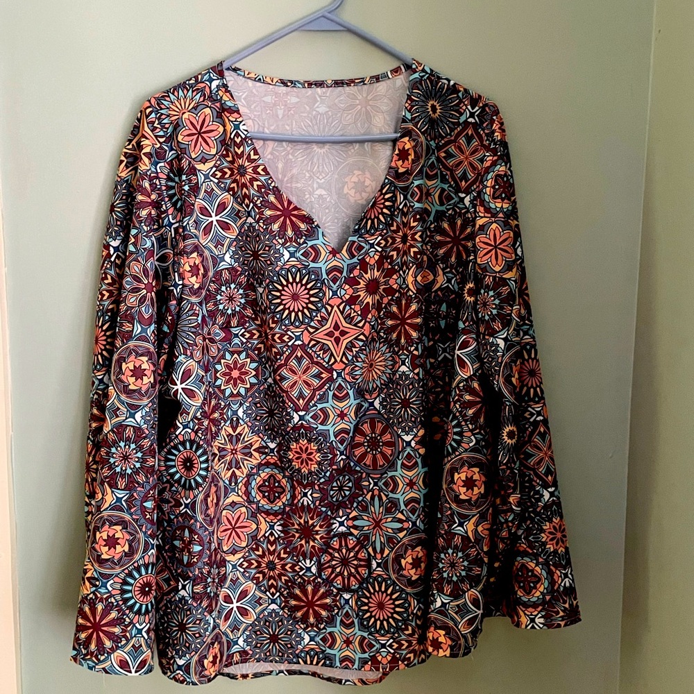 Richly colored geometric plus sized pull over blouse